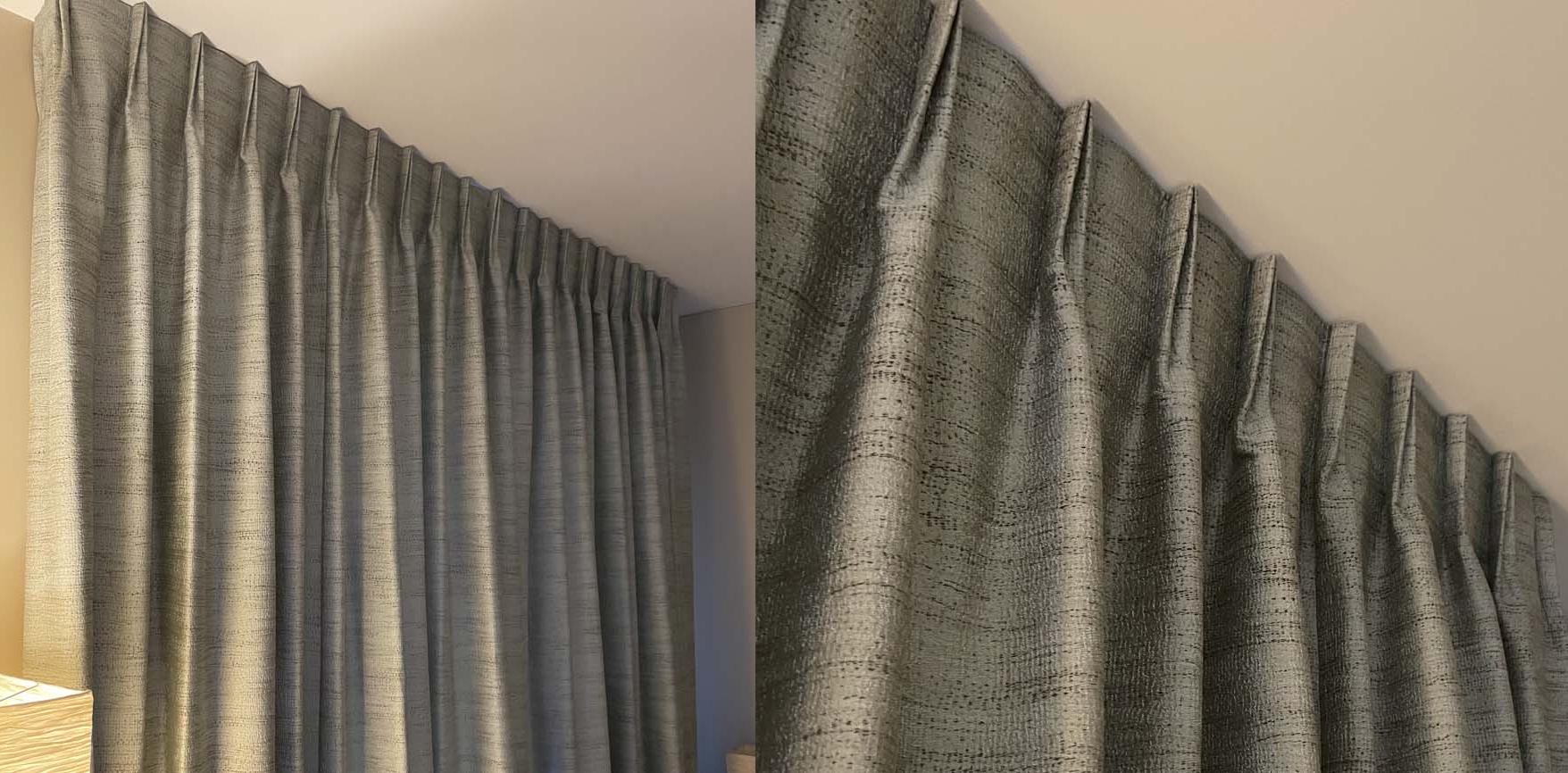 Flemish pleated curtains. The advantage : they hide the ceiling track.